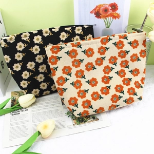 Floral corduroy cosmetic bags in black and beige patterns for travel storage