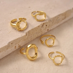 Set of five 18K gold plated geometric open rings with hollow patterns on stone