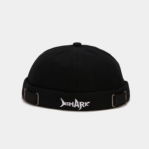 Close-up of white SHARK shark-fin embroidery on the black cotton miki docker hat brim