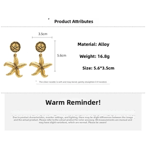 Macro shot of vintage gold starfish earrings with dimensions 5.6x3.5cm and 16.8g weight