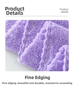 Detailed close-up of purple coral fleece towel showing reinforced stitching edges