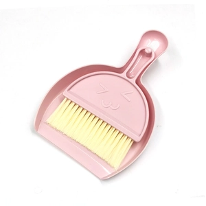 Pink mini desktop dustpan and yellow brush set with smiley face design for keyboard cleaning