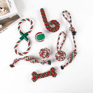 Detail view of 8-piece Christmas themed dog chew toy set with festive cotton ropes and ball