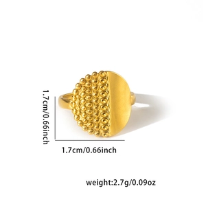 Detailed view of gold titanium steel ring with textured beads and smooth matte finish