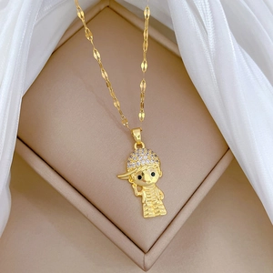 Close-up of gold titanium necklace with a sparkling cubic zirconia boy pendant