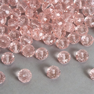 Macro view of faceted pink Aurora crystal glass beads for DIY jewelry making and crafts