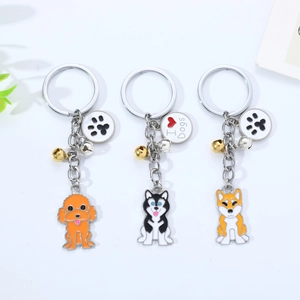 Detailansicht der Hundianhänger aus Metall mit Husky, Shiba Inu und Pfotenabdruck-Charm