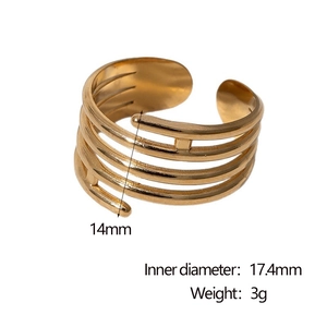 Detailed view showing 14mm width and 17.4mm inner diameter of golden spiral ring