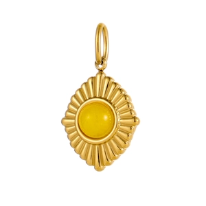 Detailed view of a gold stainless steel sunburst pendant with a round yellow gemstone center