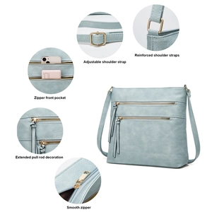 Detail view of adjustable shoulder strap and gold hardware on light blue tote bag