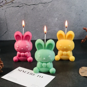 Easter bunny candles with bow ties in pink, green and yellow set for home decor
