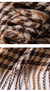 Macro shot of brown and beige houndstooth scarf showing thick wool texture and fringe detail