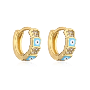 Detail of gold-plated evil eye hoop earrings with blue enamel and cubic zirconia