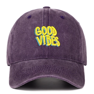 Close-up of GOOD VIBES embroidery on washed purple cotton denim baseball cap