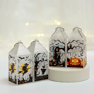 Set of 4 Halloween pumpkin lamps with witch and grim reaper designs on a white stand