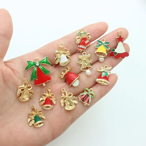 Handheld collection of 13 colorful enamel Christmas bell charms with pearls and rhinestones