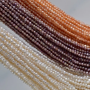 Macro detail of 4-5mm natural freshwater baroque pearls in white, purple, and orange