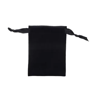 Detail of black velvet drawstring pouch with satin ribbons for jewelry storage