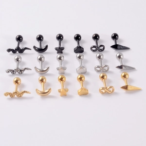 Set of 18 stainless steel stud earrings in snake, moon, star, and heart shapes
