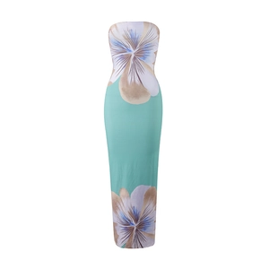 Detailed view of mint green strapless maxi dress with large floral patterns and slim fit