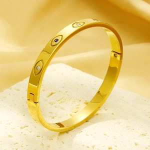 Detail of 6mm gold-plated bangle with sparkling evil eye marquise-cut stones and blue zircon