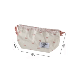 Detail view of cream tissue box cover with pink bows and 18x15x11cm size measurements