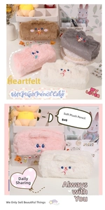 Detail of plush cartoon pencil cases featuring bear and rabbit embroidery in soft fur