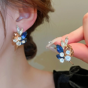 Luxurious geometric teardrop stud earrings with colorful crystals on golden metal base