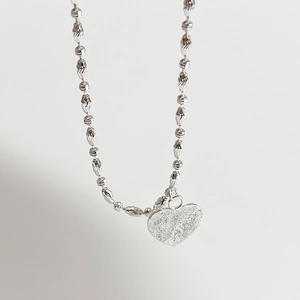 Sparkling 925 sterling silver heart necklace with unique textured olive chain links