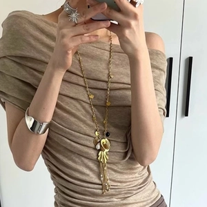 French retro gold shell tassel necklace and jewelry set worn in a natural selfie view