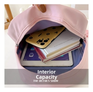 Large capacity view of the pink kids backpack showing storage for tablets and books