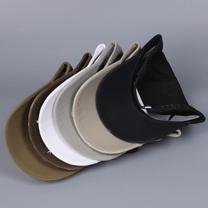 Multiple colors of distressed cotton baseball caps including brown and khaki tones