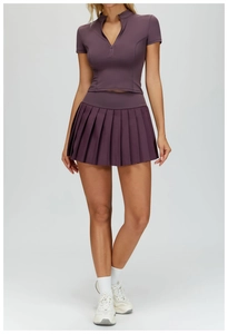 Detail of high-waist pleated tennis skirt with moisture-wicking stretch fabric