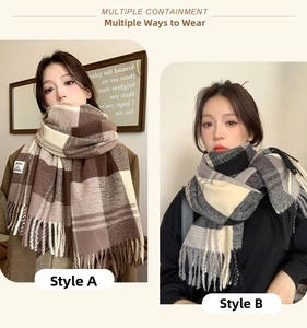 Close-up of thick plaid scarves with fringe details in brown and grey checkered patterns