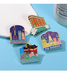 Detail of colorful enamel Shanghai landmark badges showing Oriental Pearl and Bund architecture