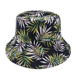 Detail of tropical palm leaf print on black cotton bucket hat with reinforced brim stitching