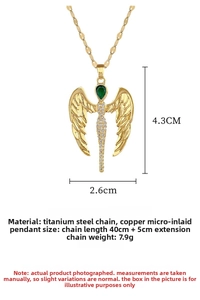 Detail of angel wing necklace with green teardrop gemstone and white zircons