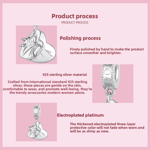 Detailed view of S925 sterling silver heart charm with bow relief and platinum plating