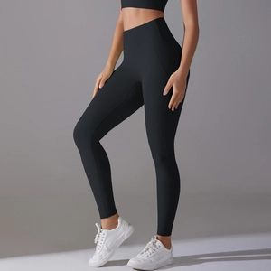 Detail of high waist seamless yoga leggings in black fabric with elastic body shaping fit