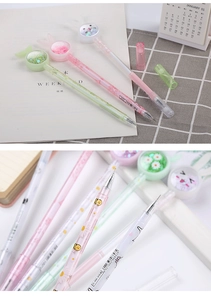 Close-up of creative gel pens with colorful sequins, daisy patterns, and flowing sand caps