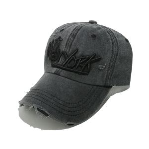 Close-up of distressed dark grey cotton baseball cap with New York 3D embroidery