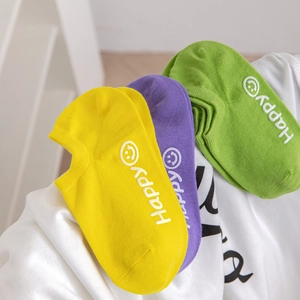 Three pairs of colorful cotton low cut socks featuring embroidered smiley faces and logos