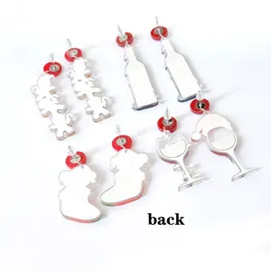 Back view of Christmas acrylic earrings set featuring gingerbread man and stocking designs