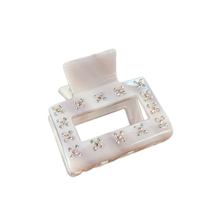 Elegant beige acetate square hair claw clip with rhinestones shown on white background