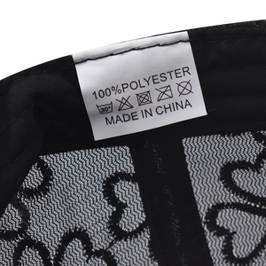 Lace breathable baseball cap featuring heart mesh pattern and polyester care label