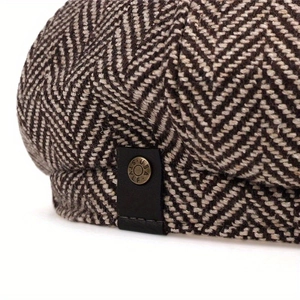 Brown herringbone wool newsboy cap with vintage metal buckle and black leather detail