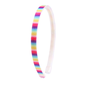 Close-up of rainbow glitter headband showing non-slip inner teeth and colorful texture