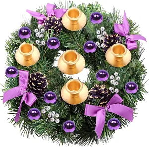 Christmas wreath with purple bows, pine cones, and four gold candle holders