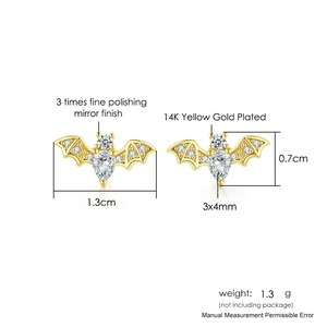 Detail of 14K gold plated bat studs with white zirconia and mirror polished finish