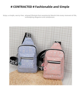 Detail of light blue and pink crossbody chest bags with all-over letter patterns